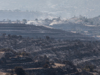 Smoke is coming out of the burnt areas, Alassa, Cyprus, on Aug. 5, 2023. Fire Department and Forest Department units, patrol the area around...