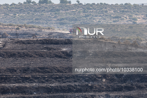 A fire track is patrolling the area, Alassa, Cyprus, on Aug. 5, 2023. Fire Department and Forest Department units, patrol the area around Al...