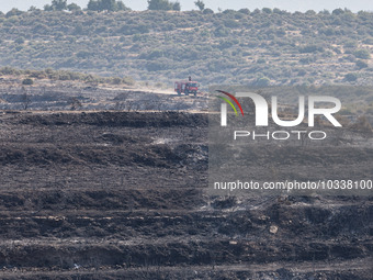 A fire track is patrolling the area, Alassa, Cyprus, on Aug. 5, 2023. Fire Department and Forest Department units, patrol the area around Al...