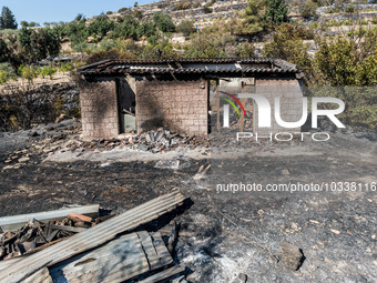 A burnt building is seen at the area, Alassa, Cyprus, on Aug. 5, 2023. Fire Department and Forest Department units, patrol the area around A...