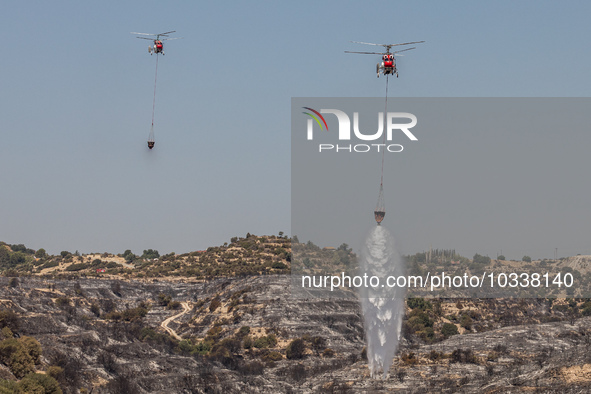 Helicopters of the Jordanian Fire Department throws water over the burnt area, Alassa, Cyprus, on Aug. 5, 2023. Jordan helps with two helico...