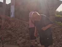 DEZHOU, CHINA - AUGUST 6, 2023 - Citizens watch as the wall of a house collapses after an earthquake in Pingyuan County, Dezhou, Shandong pr...