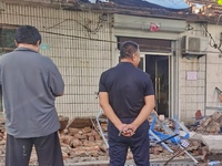 DEZHOU, CHINA - AUGUST 6, 2023 - Citizens watch as the wall of a house collapses after an earthquake in Pingyuan County, Dezhou, Shandong pr...