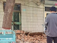 DEZHOU, CHINA - AUGUST 6, 2023 - Citizens watch as the wall of a house collapses after an earthquake in Pingyuan County, Dezhou, Shandong pr...