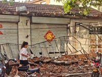 DEZHOU, CHINA - AUGUST 6, 2023 - A citizen passes a collapsed house after an earthquake in an urban area of Pingyuan County, in Dezhou, Shan...