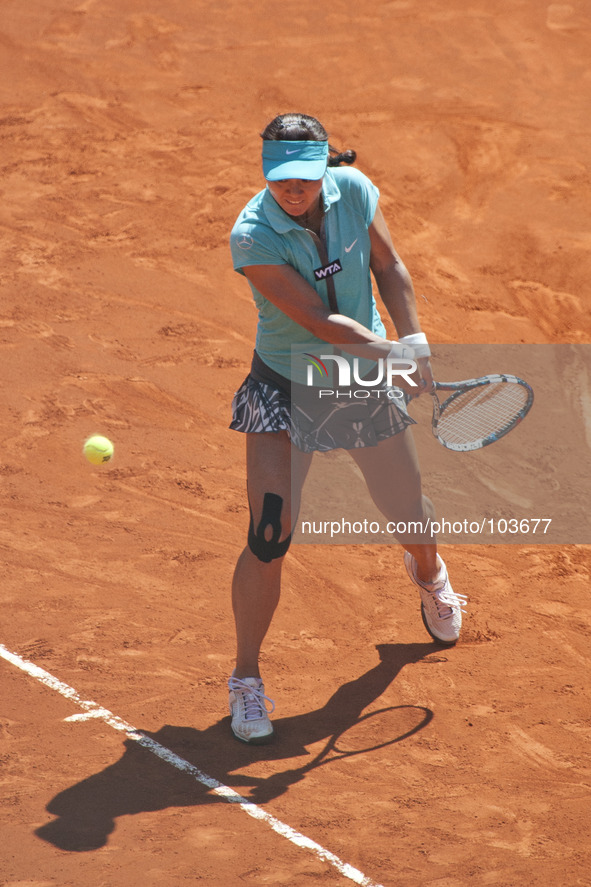 Li Na of China in action against Sloane Stephens of USA during day six of the Mutua Madrid Open tennis tournament at the Caja Magica on May...