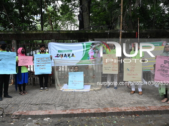 Activist of a social organization hold placards during an awareness campaign against mosquito-borne diseases, in Dhaka, Bangladesh, on Augus...