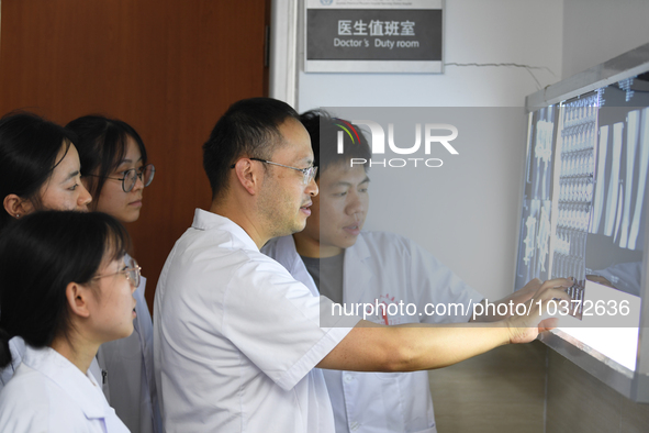 GUIYANG, CHINA - AUGUST 15, 2023 - Wang Lei (2nd R), head of the Department of bone surgery, works at a clinic in Guiyang, Guizhou province,...