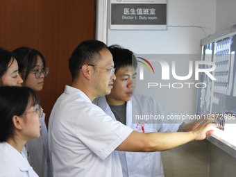 GUIYANG, CHINA - AUGUST 15, 2023 - Wang Lei (2nd R), head of the Department of bone surgery, works at a clinic in Guiyang, Guizhou province,...