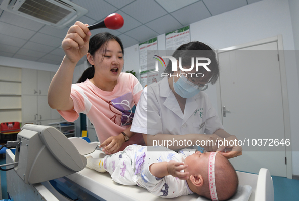 GUIYANG, CHINA - AUGUST 15, 2023 - Pediatrician Su Juan gives a baby a child health checkup in Guiyang, Guizhou province, China, August 15,...