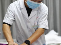 GUIYANG, CHINA - AUGUST 15, 2023 - Zeng Ting, an acupuncturist at the People's Hospital, performs acupuncture treatment on a patient in Guiy...