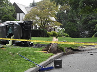 Vehicle strikes a pole and overturns on a driveway of a home in Glen Rock, New Jersey, United States on August 15, 2023. A vehicle struck a...