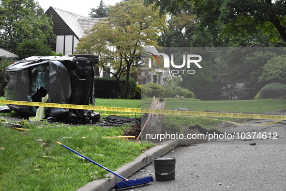 Vehicle strikes a pole and overturns on a driveway of a home in Glen Rock, New Jersey, United States on August 15, 2023. A vehicle struck a...