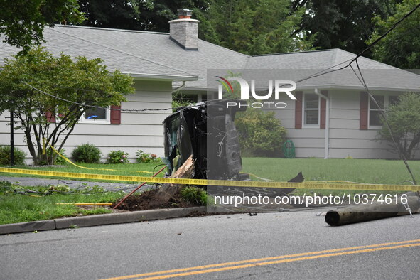 Vehicle strikes a pole and overturns on a driveway of a home in Glen Rock, New Jersey, United States on August 15, 2023. A vehicle struck a...