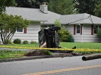 Vehicle strikes a pole and overturns on a driveway of a home in Glen Rock, New Jersey, United States on August 15, 2023. A vehicle struck a...