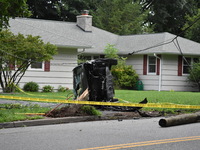 Vehicle strikes a pole and overturns on a driveway of a home in Glen Rock, New Jersey, United States on August 15, 2023.  One person was sev...