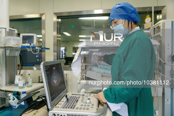 TENGZHOU, CHINA - AUGUST 17, 2023 - A neonatal nurse gives a color ultrasound examination to a child in Tengzhou city, Shandong province, Ch...