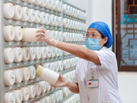 TENGZHOU, CHINA - AUGUST 17, 2023 - Traditional Chinese medicine practitioner Wang Ting dispenses traditional Chinese medicine granules in T...