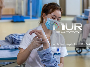 Rehabilitation doctor Zhou Shijie works on a patient in Chongqing, China, August 18, 2023. August 19 is the Chinese Doctor's Day. (