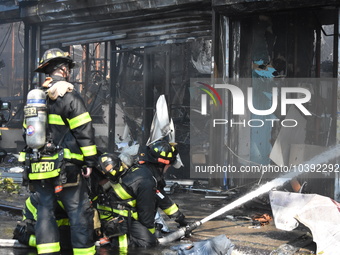 5-alarm fire in Brooklyn, New York, United States on August 20, 2023 damages several stores on Lee Avenue Sunday. Several firefighters were...