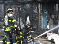 5-alarm fire in Brooklyn, New York, United States on August 20, 2023 damages several stores on Lee Avenue Sunday. Several firefighters were...