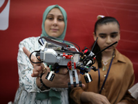 Palestinian students take part in a festival of the Science Days Palestine, at al Qattan Center in Gaza city on August 21, 2023. 
 (