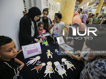 Palestinian students take part in a festival of the Science Days Palestine, at al Qattan Center in Gaza city on August 21, 2023. 
 (