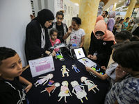 Palestinian students take part in a festival of the Science Days Palestine, at al Qattan Center in Gaza city on August 21, 2023. 
 (