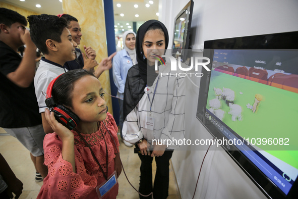 Palestinian students take part in a festival of the Science Days Palestine, at al Qattan Center in Gaza city on August 21, 2023. 
 