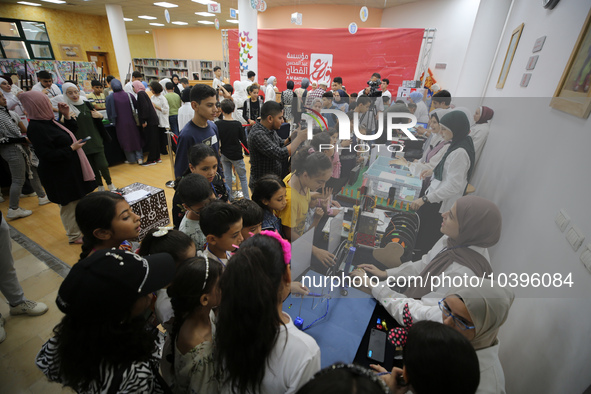 Palestinian students take part in a festival of the Science Days Palestine, at al Qattan Center in Gaza city on August 21, 2023. 
 