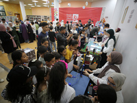 Palestinian students take part in a festival of the Science Days Palestine, at al Qattan Center in Gaza city on August 21, 2023. 
 (