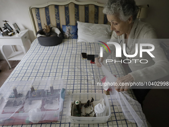 Catia Lattouf, health couch, rescuer and hummingbird keeper, gets ready to feed injured hummingbirds inside her apartment in Mexico City. (