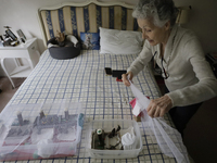 Catia Lattouf, health couch, rescuer and hummingbird keeper, gets ready to feed injured hummingbirds inside her apartment in Mexico City. (