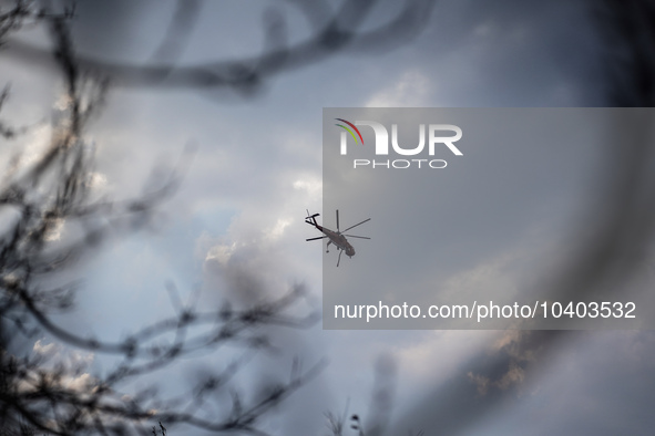 A helicopter is operating in the sky over Mount Parnitha in Athens, Greece, on August 23, 2023 