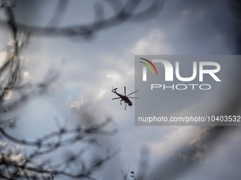 A helicopter is operating in the sky over Mount Parnitha in Athens, Greece, on August 23, 2023 (