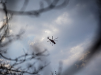 A helicopter is operating in the sky over Mount Parnitha in Athens, Greece, on August 23, 2023 (