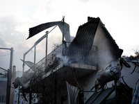 Damaged buildings from the wildfire on Mount Parnitha in Athens, Greece, are being photographed on  August 23, 2023 (