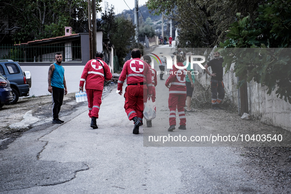 Members of the Red Cross are helping the residents of Mount Parnitha in Athens, Greece, on August 23, 2023 