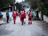 Members of the Red Cross are helping the residents of Mount Parnitha in Athens, Greece, on August 23, 2023 (