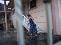 Residents of Mountain Parnitha, Greece, are trying to clean their yards of ash and coal on  August 23, 2023 (