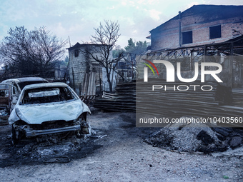 Burning cars are being destroyed by the fire on Mount Parnitha in Athens, Greece, on August 23, 2023 (