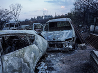 Burning cars are being destroyed by the fire on Mount Parnitha in Athens, Greece, on August 23, 2023 (