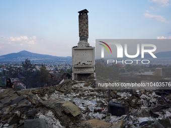 A fireplace remains of a house destroyed by wildfire on Mount Parnita, Greece, on August 23, 2023 (