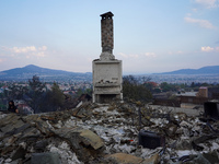 A fireplace remains of a house destroyed by wildfire on Mount Parnita, Greece, on August 23, 2023 (