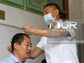 LINYI, CHINA - AUGUST 25, 2023 - A doctor performs balanced acupuncture for villagers in Linyi city, Shandong province, Aug 25, 2023. Throug...