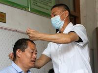 LINYI, CHINA - AUGUST 25, 2023 - A doctor performs balanced acupuncture for villagers in Linyi city, Shandong province, Aug 25, 2023. Throug...