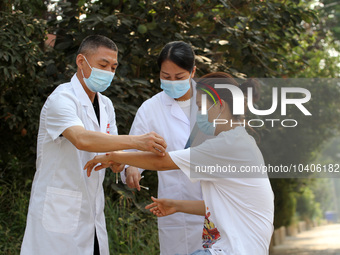 LINYI, CHINA - AUGUST 25, 2023 - A doctor performs balanced acupuncture for villagers in Linyi city, Shandong province, Aug 25, 2023. Throug...