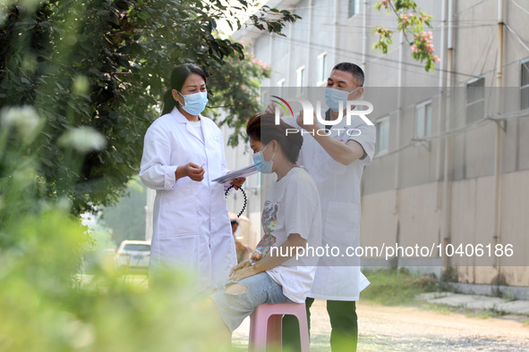 LINYI, CHINA - AUGUST 25, 2023 - A doctor performs balanced acupuncture for villagers in Linyi city, Shandong province, Aug 25, 2023. Throug...