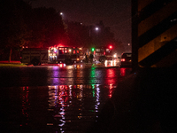 ROYAL OAK, MI - AUGUST 24, 2023: Firemen from the Royal Oak Fire Department blockade a flooded street after a severe thunderstorm that inclu...