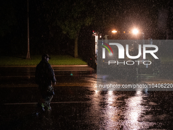 ROYAL OAK, MI - AUGUST 24, 2023: Firemen from the Royal Oak Fire Department blockade a flooded street after a severe thunderstorm that inclu...